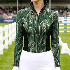 Woman wearing RIDER ATELIER abstract horse head zebra print quarter-zip top at the show jumping arena