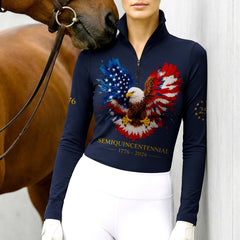 Model wearing the RIDER ATELIER American Eagle Semiquincentennial Riding Top at the stable, with a chestnut horse, highlighting the print’s vibrant colors
