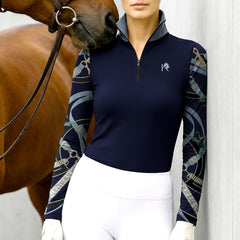 Woman wearing RIDER ATELIER bridle sleeve quarter-zip top with a chestnut horse