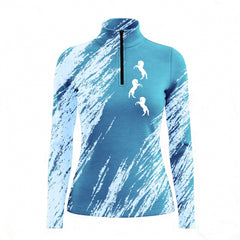 Woman wearing RIDER ATELIER brushstroke horse quarter-zip top at the show jumping arena
