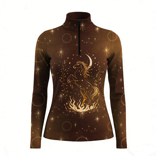 Woman wearing RIDER ATELIER celestial horse quarter-zip top leaning on a wooden fence