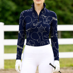Woman wearing RIDER ATELIER cowboy western navy blue quarter-zip top at the outdoor pasture