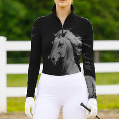 Woman wearing RIDER ATELIER dynamic sketch quarter-zip top at the outdoor pasture
