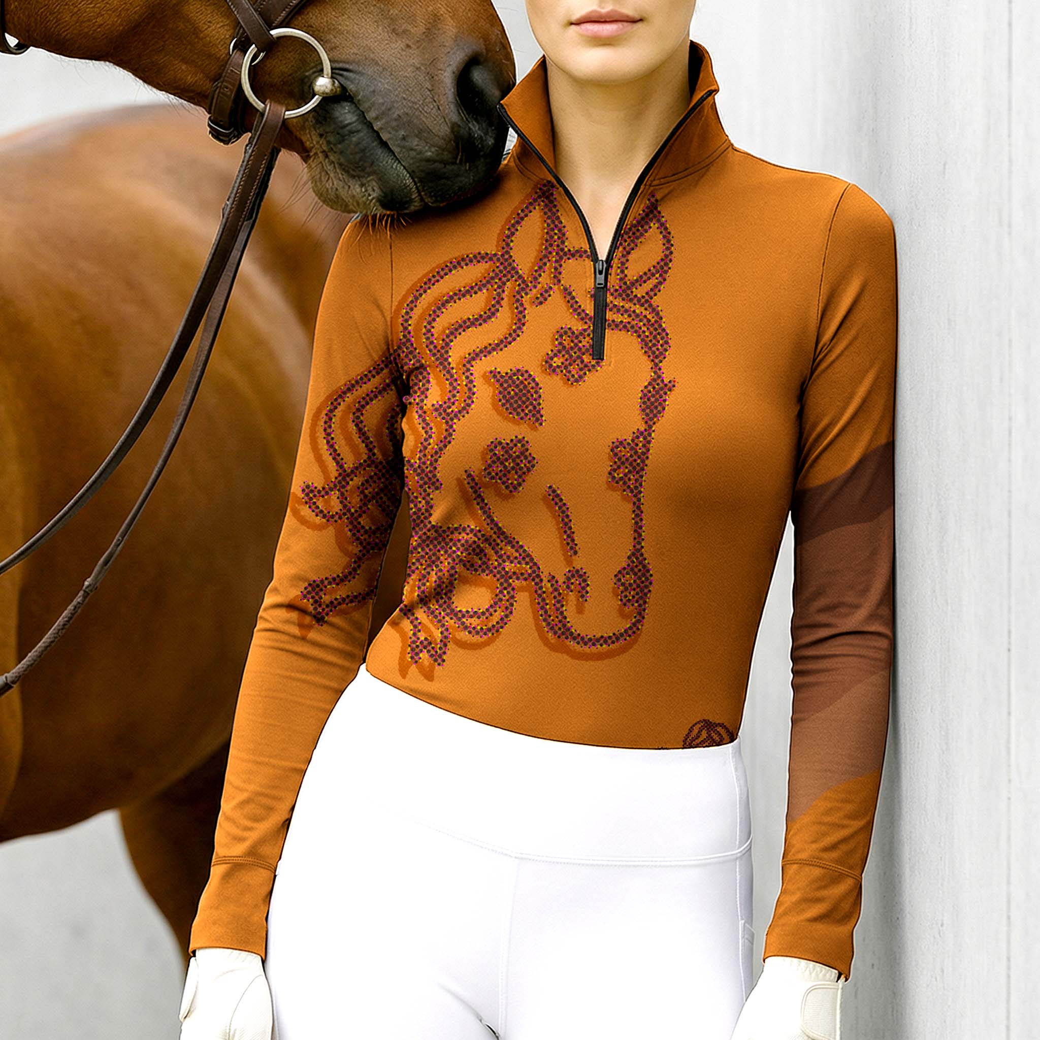 Woman wearing RIDER ATELIER floral horse head quarter-zip top with a chestnut horse
