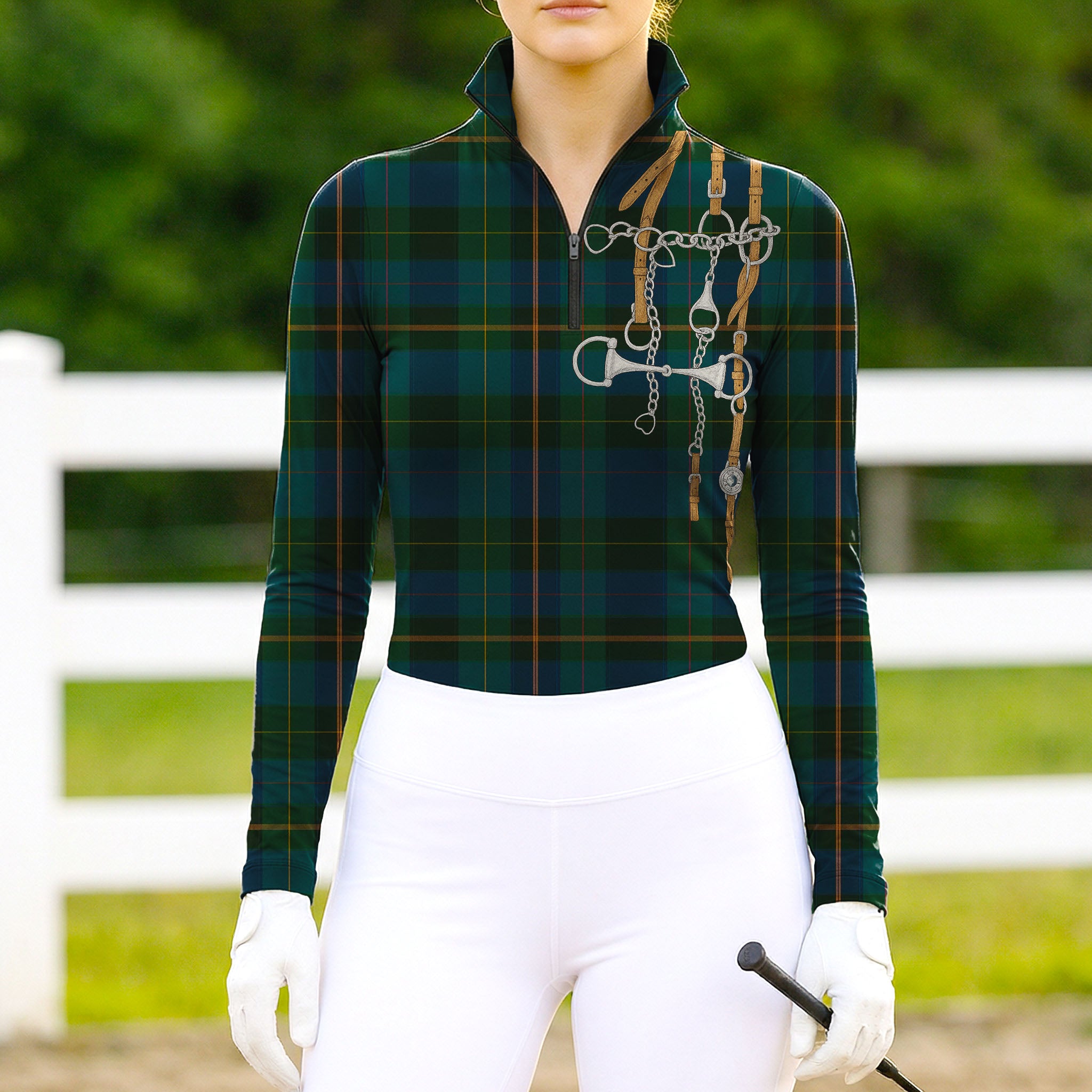 Woman wearing RIDER ATELIER green plaid snaffle bit tartan quarter-zip top at the outdoor pasture
