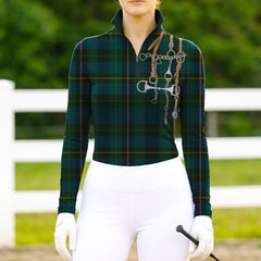 Woman wearing RIDER ATELIER green plaid snaffle bit tartan quarter-zip top at the outdoor pasture