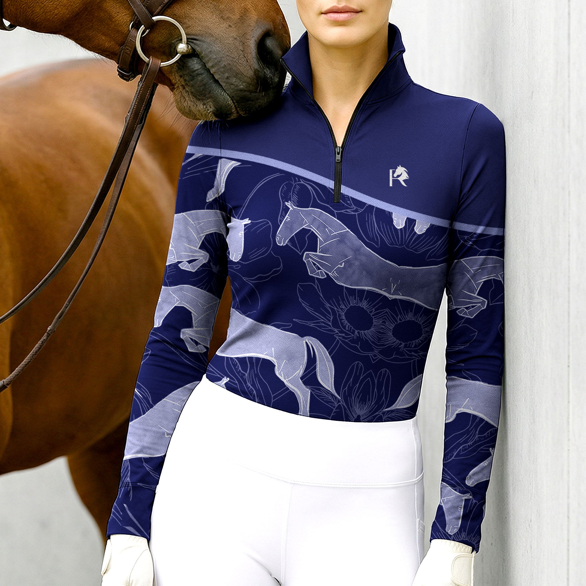 Woman wearing RIDER ATELIER jumping horse floral quarter-zip top with a chestnut horse