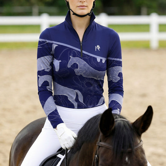 Woman wearing RIDER ATELIER jumping horse floral quarter-zip top while riding a horse