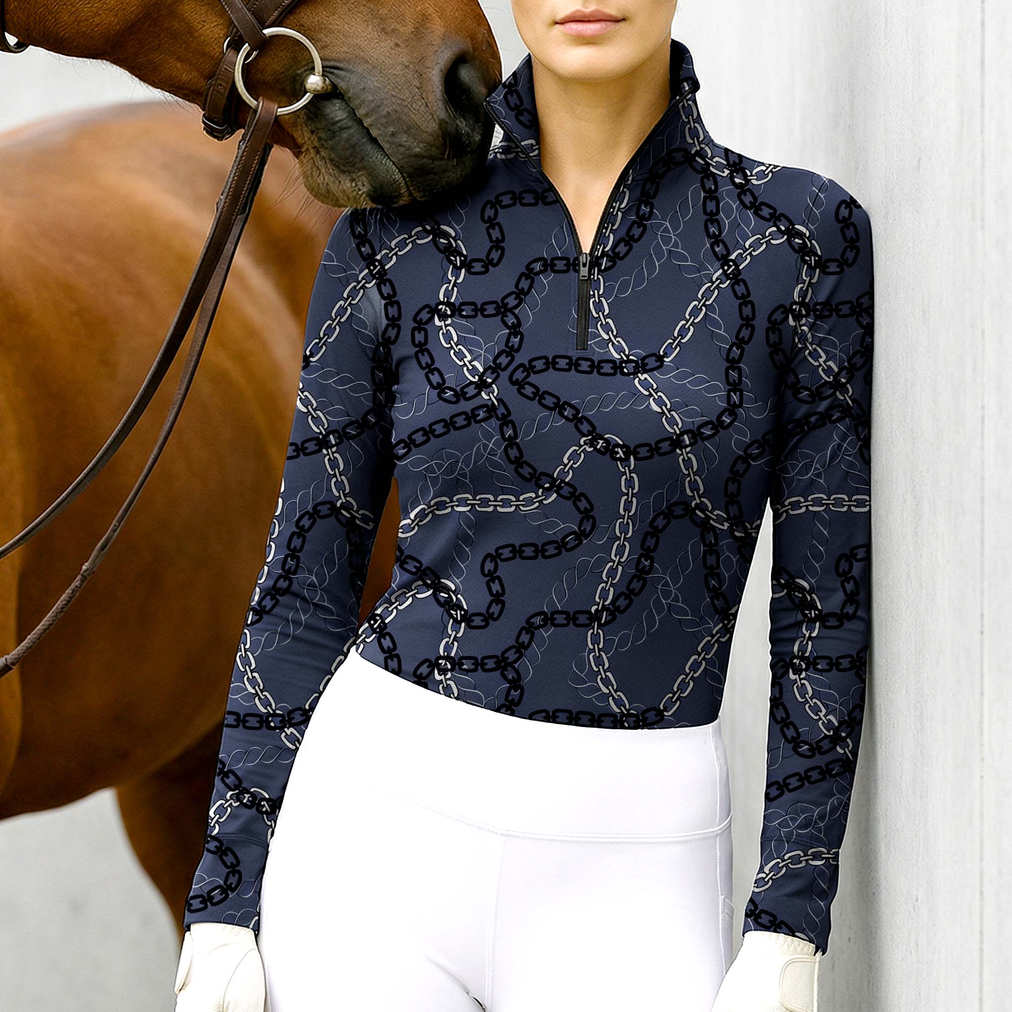 Woman wearing RIDER ATELIER luxury chain link quarter-zip top with a chestnut horse