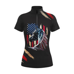 Studio flat view of the black version of the RIDER ATELIER Patriotic American Flag Horse Print Short-Sleeve Quarter-Zip Riding Top, showcasing the full print and quarter-zip collar
