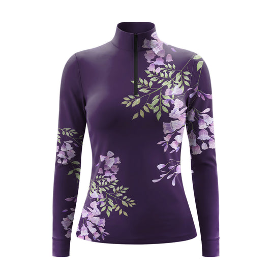 Studio shot of the RIDER ATELIER Purple Wisteria Floral Print Long-Sleeve Quarter-Zip Riding Top, showing the full cascading wisteria print, quarter-zip collar, and fabric texture against a clean white background
