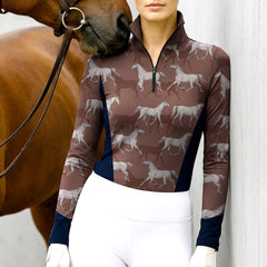 Woman wearing RIDER ATELIER sketch galloping horse quarter-zip top with a chestnut horse