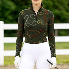 Woman wearing RIDER ATELIER snaffle bit & bridle olive quarter-zip top at the outdoor pasture