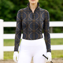 Woman wearing RIDER ATELIER snaffle bit lattice charcoal quarter-zip top at the outdoor pasture