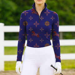 Woman wearing RIDER ATELIER southwestern quarter-zip top at the outdoor pasture

