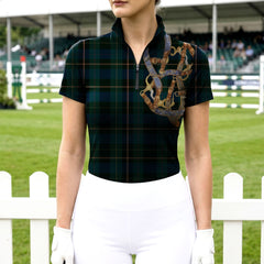 Woman wearing RIDER ATELIER tartan equestrian tack short sleeve quarter-zip top at the show jumping arena

