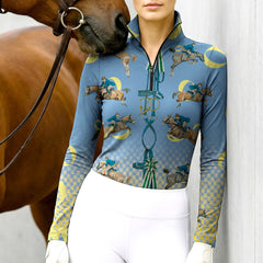 Woman wearing RIDER ATELIER vintage show jumping teal quarter-zip top with a chestnut horse