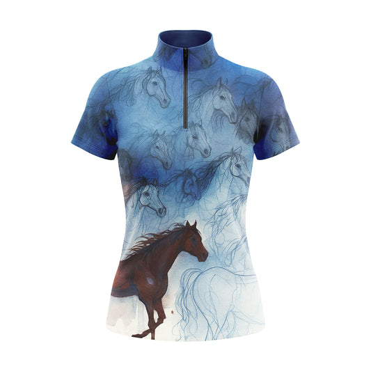 Studio shot of the RIDER ATELIER Watercolor Horse Sketch Print Short-Sleeve Quarter-Zip Riding Top, showing the full layered horse sketch print, gradient blue base, quarter-zip collar, and fabric texture against a clean white background
