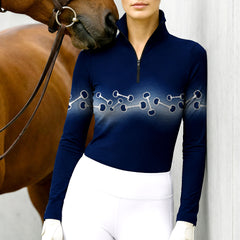 Woman wearing RIDER ATELIER wave snaffle bit quarter-zip top with a chestnut horse
