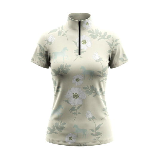 White background studio shot of soft sage white floral ghost horse print short sleeve quarter zip riding top