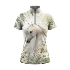 White background studio shot of off-white base soft sage watercolor white horse eucalyptus floral short sleeve quarter zip riding top