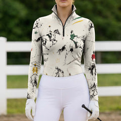 Model wearing dynamic ink brush jump rider print riding top at outdoor equestrian show jumping arena with spectator stands