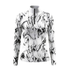 Studio white‑background product mockup of clean‑white long‑sleeve quarter‑zip riding top with all‑over sketch‑style galloping‑horse and ink‑splash print