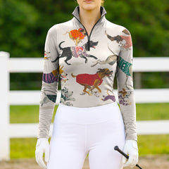 Full-body model shot wearing cozy cottage canine print equestrian riding top at sunlit green pasture white wooden fence