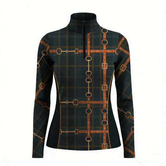 Studio white‑background product mockup of women’s dark green tartan long‑sleeve quarter‑zip riding top with full vintage leather‑strap bridle‑hardware print