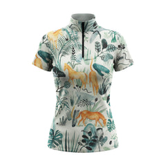 White background studio shot of off-white watercolor tropical jungle leaf golden horse allover print short sleeve quarter zip riding top
