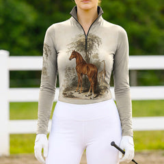 Full-body model shot wearing cream vintage safari wildlife equestrian riding top at sunlit green pasture white wooden fence