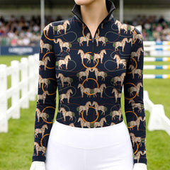 Model wearing sophisticated sketched horse hoop print riding top at outdoor equestrian show jumping arena with spectator stands