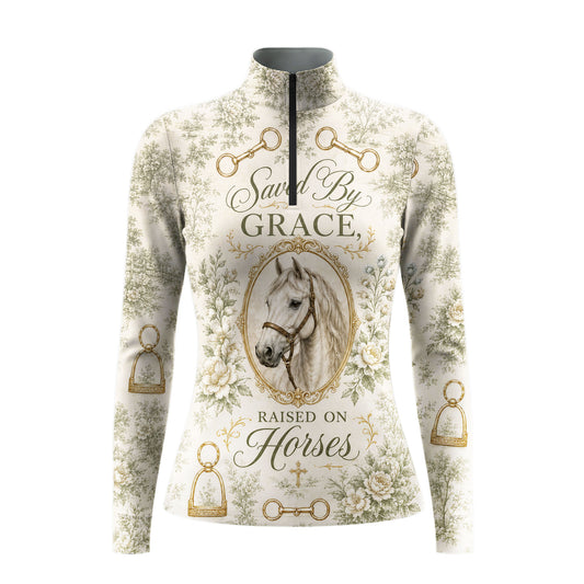 White background studio shot of full cream sage green vintage toile floral gold stirrup bit framed white horse Saved By Grace tiny cross long sleeve quarter zip riding top
