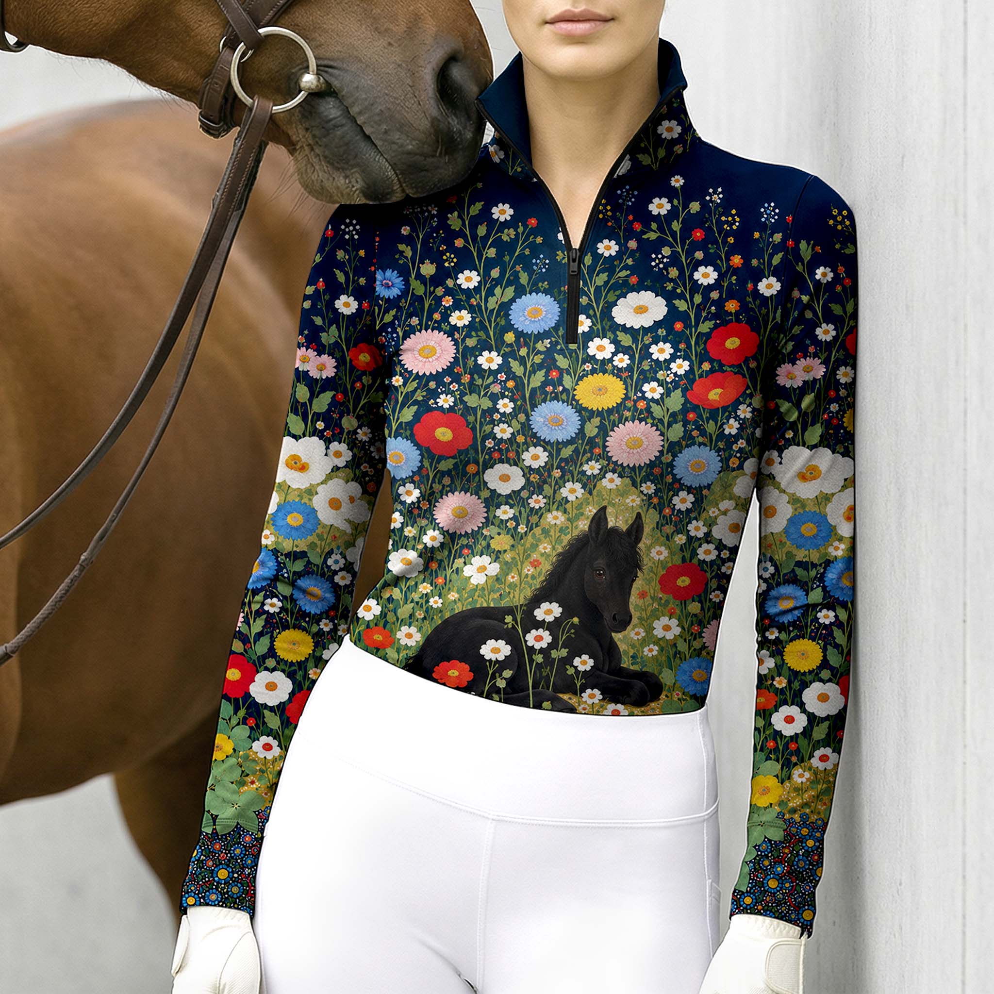 Close view of the black foal and wildflower print on the navy riding top