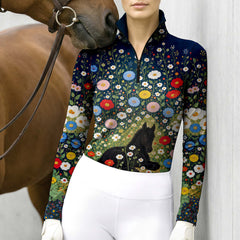 Close view of the black foal and wildflower print on the navy riding top