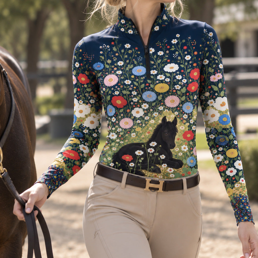 Close view of the dotted border at the hem of the navy floral foal print riding top