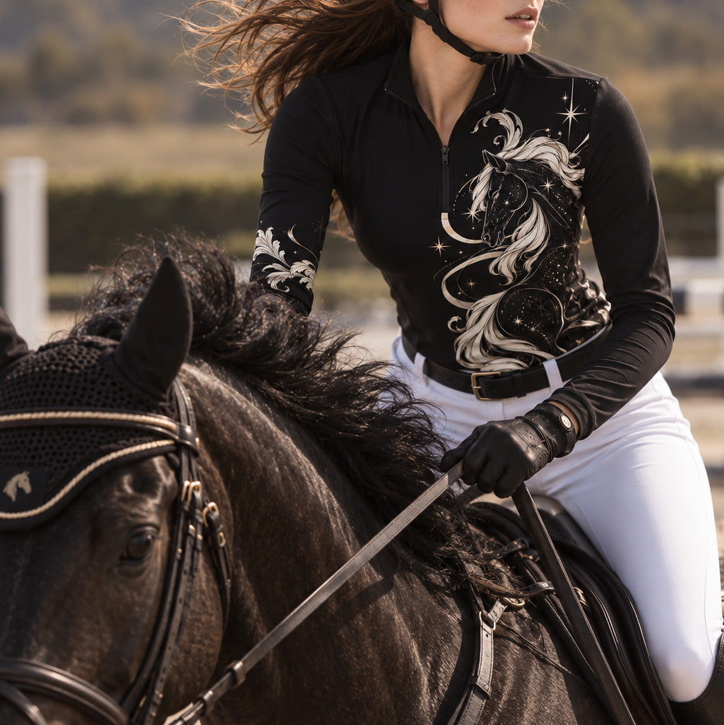 Rider wearing the top while mounted on a black horse in an outdoor arena