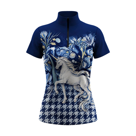 Studio front view of blue short sleeve quarter zip riding top laid flat on a white background