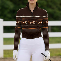 Full torso front view of the riding top worn by a rider at a barn paddock