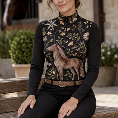 Black long sleeve riding top with chestnut horse and botanical print worn during casual barn time