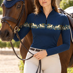 Navy printed riding top worn with white breeches while riding a brown horse outdoors