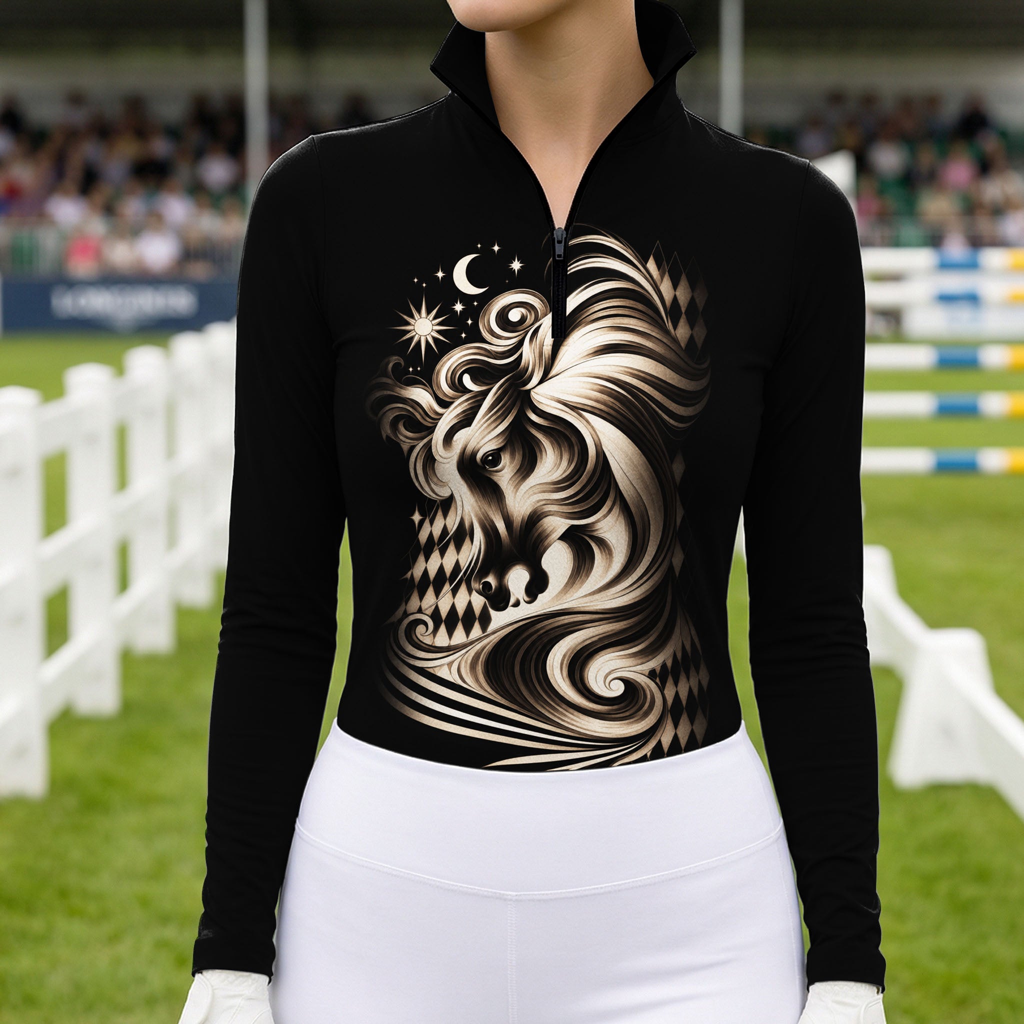 Woman wearing the black celestial horse print riding top with white breeches while standing near a brown horse with leather bridle