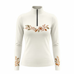 Light off white long sleeve quarter zip riding top with warm brown, rust orange and olive green floral artwork across the upper chest