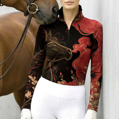 Woman wearing the black printed riding top standing next to a brown horse