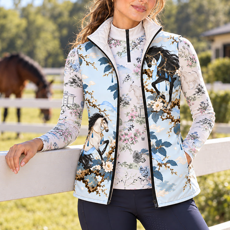 Close up of pale blue horse and floral print showing prancing horse with gold harness, blue tassels and light blue ribbons