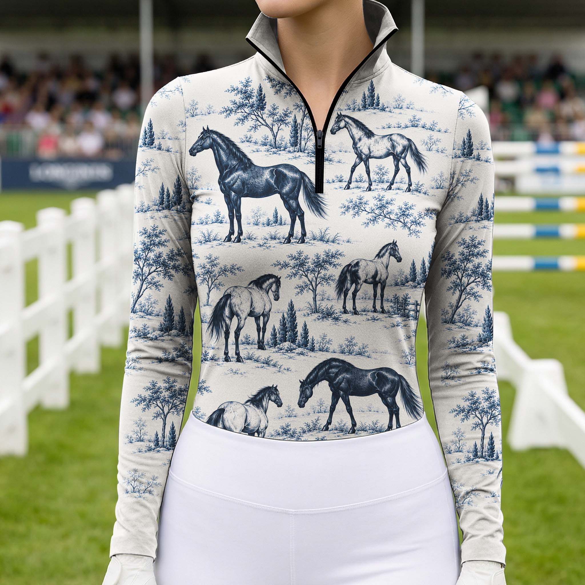 Rider wearing the blue print riding top while mounted on a brown horse