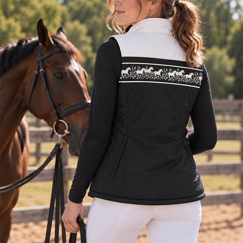 Reversible vest shown on the black and white side with horse and vine print band and side entry pockets