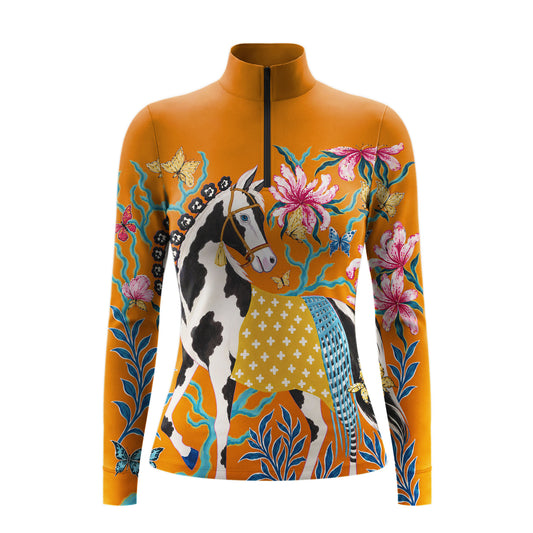 Warm orange long sleeve quarter zip riding top with black and white pinto horse, pink lilies, teal vines, and butterflies on the front