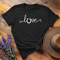 Black horse shoe love equestrian t-shirt with white script print, flat lay on wooden background