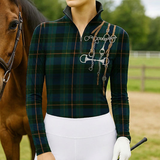 Woman standing with chestnut horse wearing green plaid equestrian tack bouquet print quarter-zip riding top at the arena